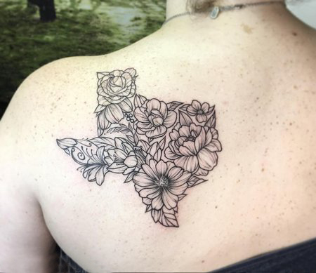 点击大图看下一张：女生背部黑色线条创意唯美花朵纹身图片