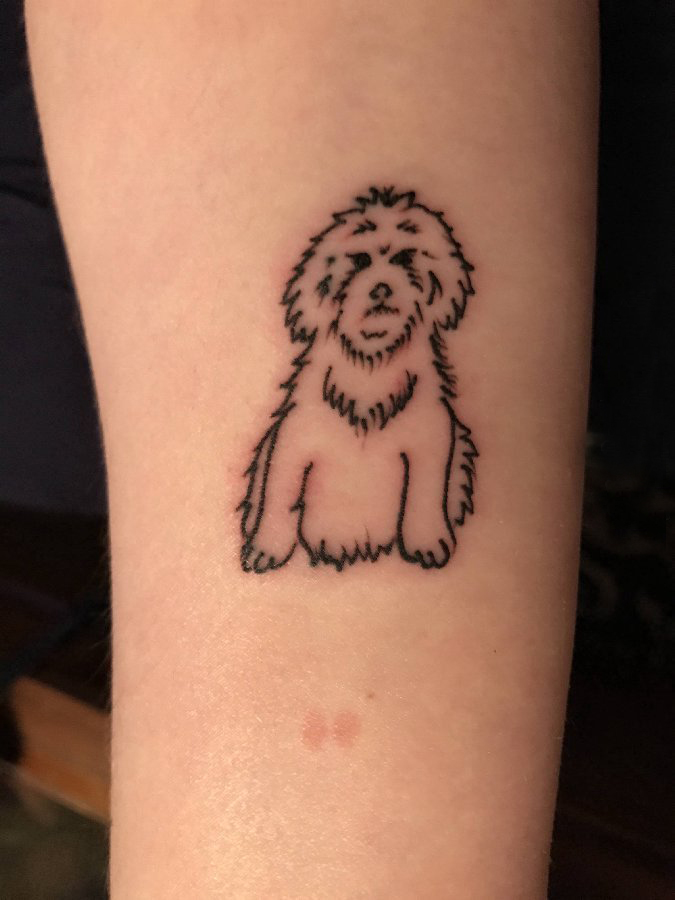 点击大图看下一张：女生小腿上黑色简单线条可爱小动物狗纹身图片