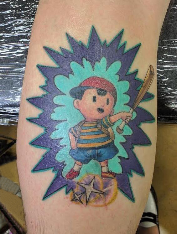 点击大图看下一张：男生手臂上彩绘水彩素描可爱卡通纹身图片