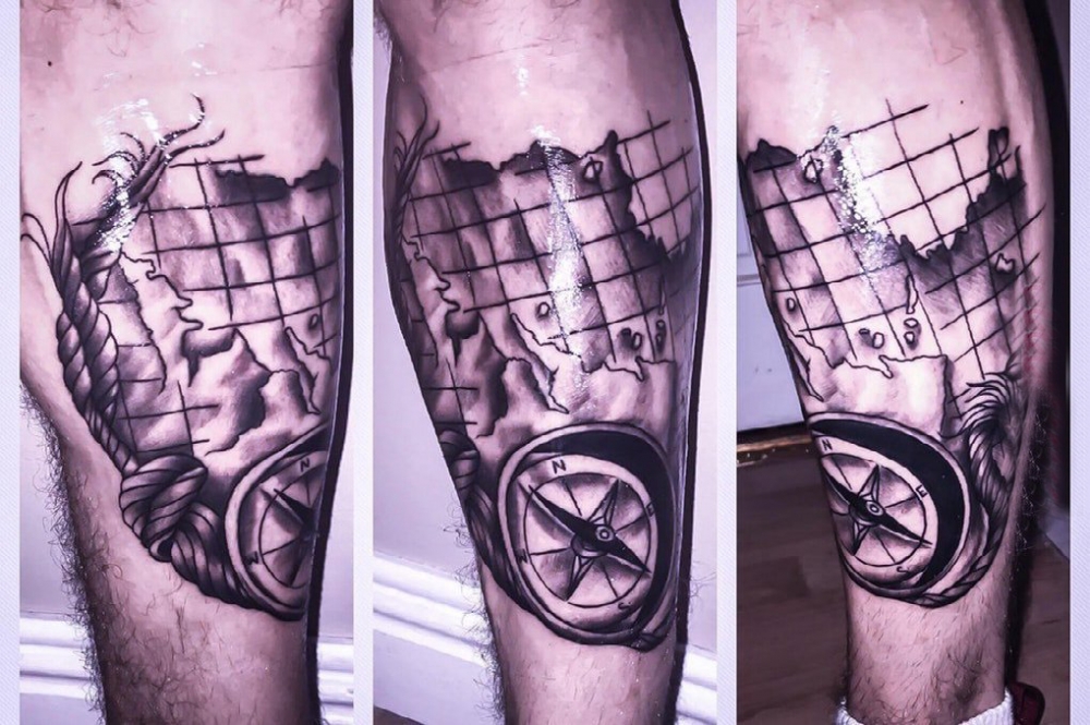 点击大图看下一张：指南针纹身 男生小腿上指南针纹身图片
