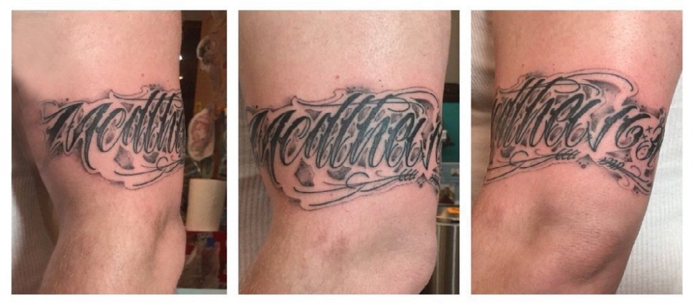 点击大图看下一张：花体英文纹身 男生手臂上黑色纹身花体英文纹身图片