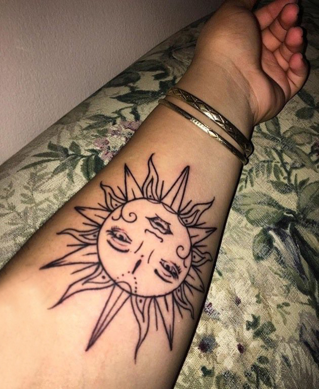 点击大图看下一张：太阳图腾纹身 女生手臂上太阳图腾纹身图片