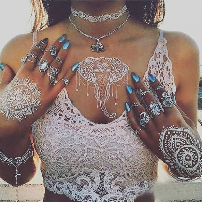 点击大图看下一张:多款女生十分喜爱的白色隐形文艺小清新纹身图案