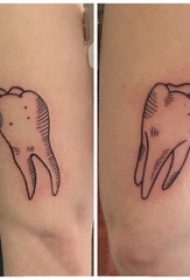 牙齿图案纹身 男生手臂上黑色的牙齿纹身图片