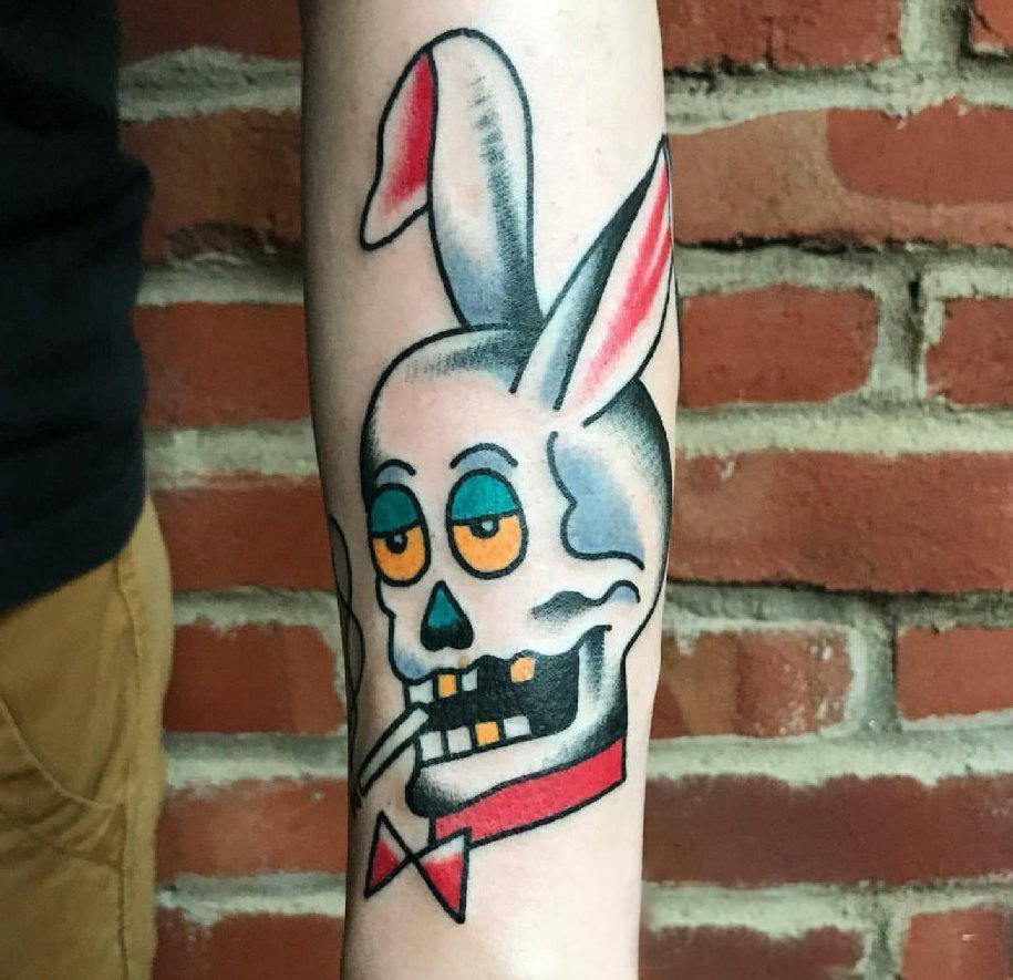 点击大图看下一张：小动物纹身 男生手臂上彩色的兔子纹身图片