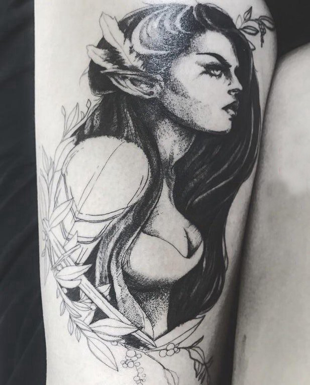 点击大图看下一张：纹身腿部 女生大腿上植物和人物肖像纹身图片