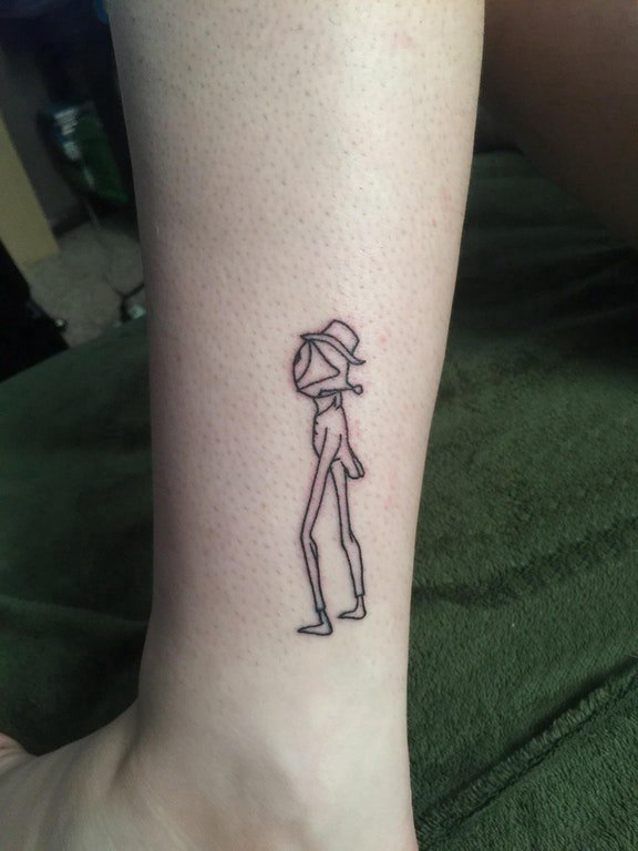 点击大图看下一张：纹身卡通 女生小腿上黑色的卡通眼睛纹身图片