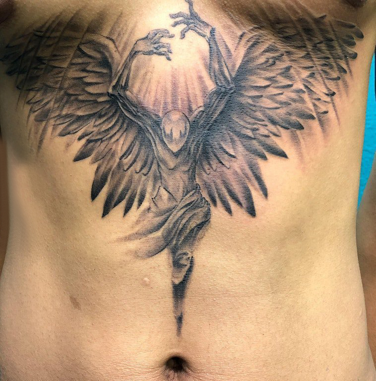 点击大图看下一张：天使翅膀纹身素材 男生胸下天使翅膀纹身图案
