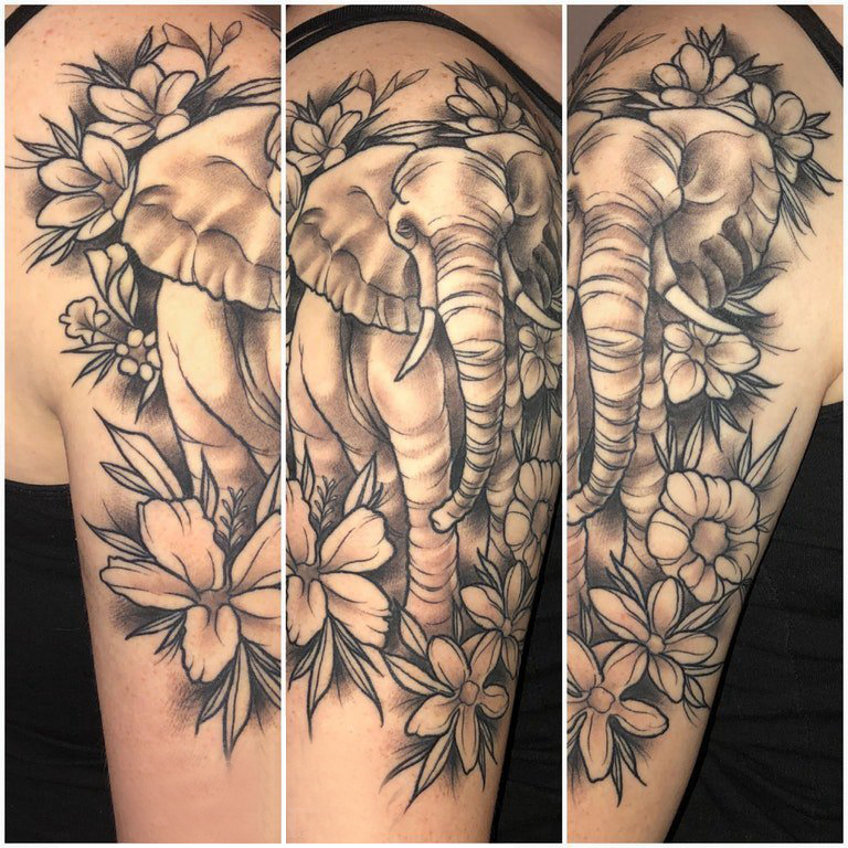 点击大图看下一张：大象纹身 女生大臂上花朵和大象纹身图片