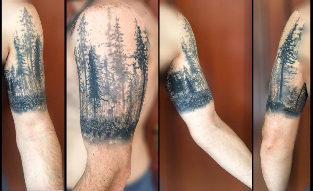 点击大图看下一张：树林纹身图案  男生手臂上创意的树林纹身图片