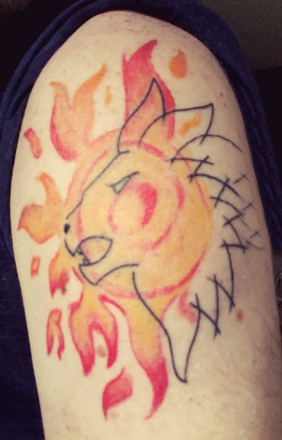 点击大图看下一张：太阳和狮子纹身图案  男生大臂上太阳和狮子纹身图片