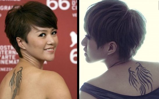 点击大图看下一张：中国纹身明星 谭维维后背上黑色的翅膀纹身图片