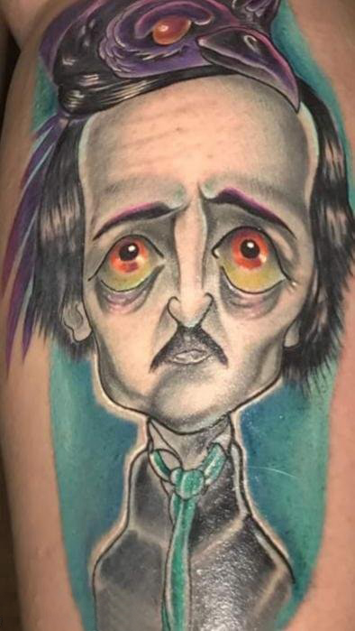 点击大图看下一张：人物肖像纹身  男生手臂上彩绘的卡通人物肖像纹身图片