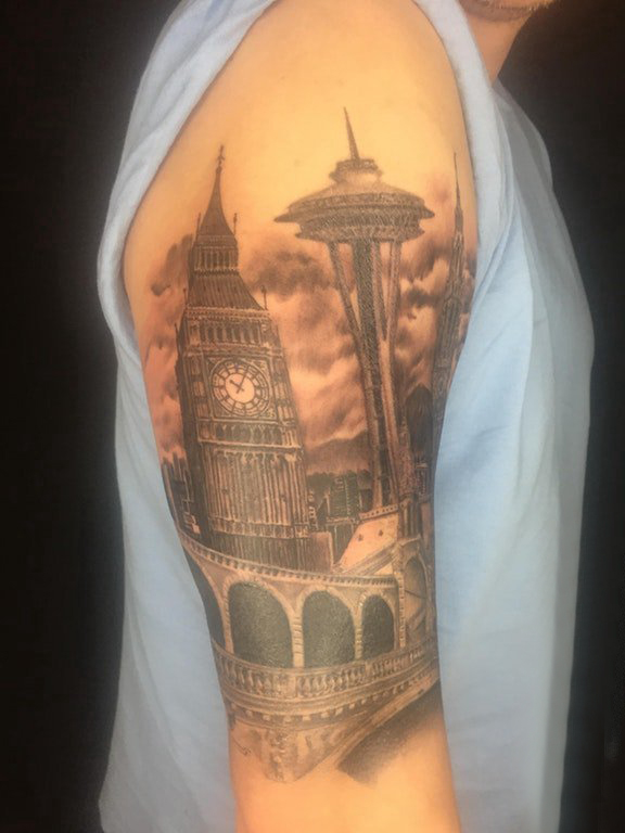 点击大图看下一张：建筑物纹身 男生大臂上雄伟的建筑物纹身图片