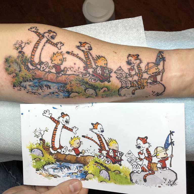 点击大图看下一张：卡通老虎纹身图案  男生手臂上彩绘的卡通老虎纹身图片