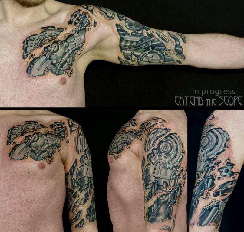点击大图看下一张：3d破皮机械纹身 男生手臂上帅气的3d破皮机械纹身图片