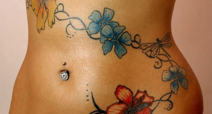 点击大图看下一张：腹部 纹身图案  女生腹部彩绘的花朵纹身图片