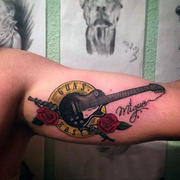 点击大图看下一张：枪炮玫瑰纹身  激情与魅力结合的枪炮玫瑰纹身图案