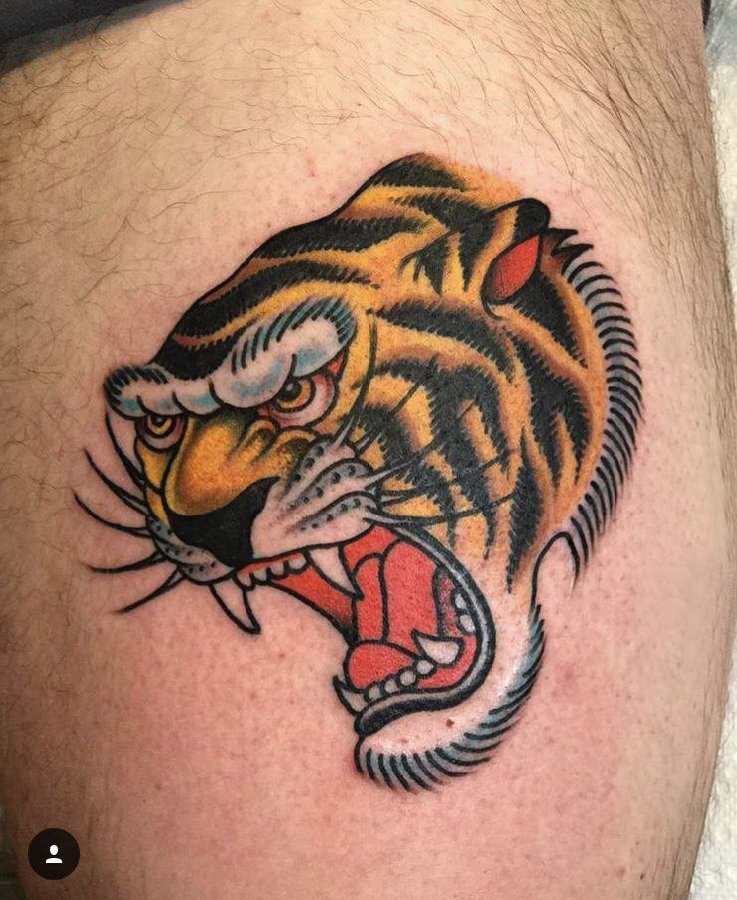 点击大图看下一张：百乐动物纹身 男生大腿上彩色的老虎纹身图片