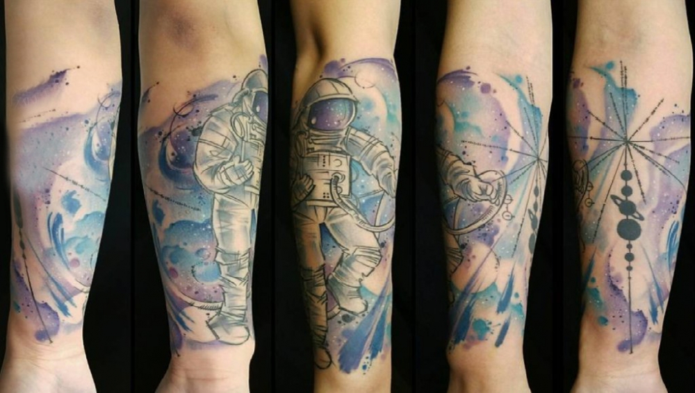 点击大图看下一张：手臂纹身图片 男生手臂上彩色的宇航员纹身图片