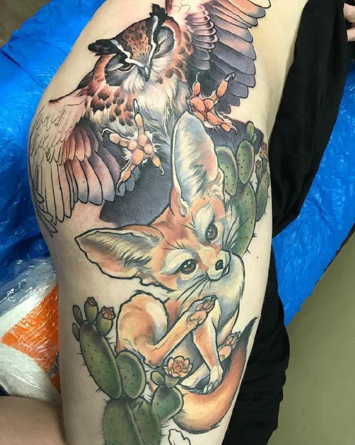 点击大图看下一张：百乐动物纹身  女生大腿上彩绘的百乐动物纹身图片