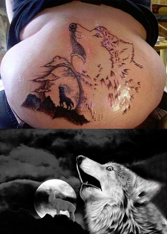 点击大图看下一张：狼纹身  男生后背上黑灰色的狼纹身图片