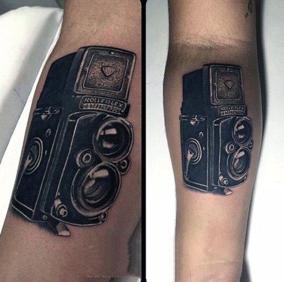 点击大图看下一张：照相机纹身   摄影爱好者奇趣的照相机纹身图案