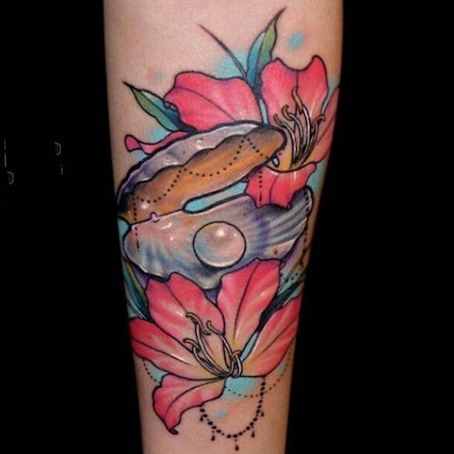 点击大图看下一张：贝壳图案纹身   唯美新颖的贝壳纹身图案