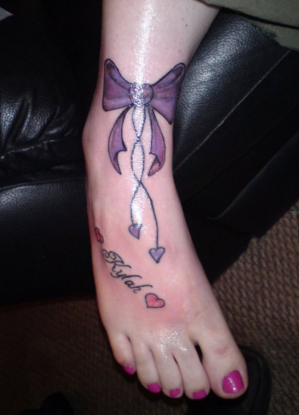 点击大图看下一张：蝴蝶结纹身图   少女心十足的蝴蝶结纹身图案