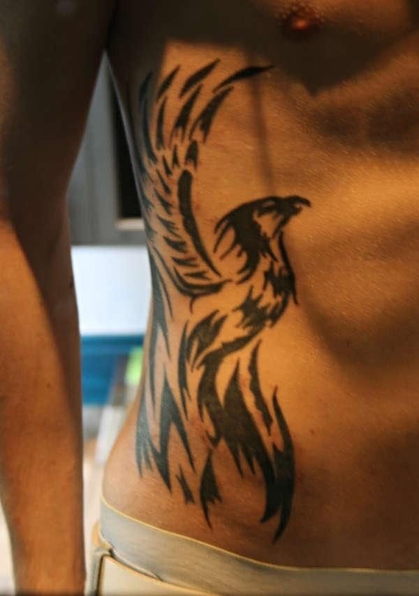 点击大图看下一张：腰部纹身   多款男生腰部的创意纹身图案