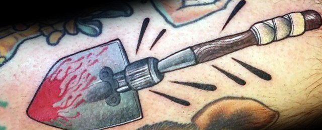 点击大图看下一张：纹身工具   创意而又别致的铲子纹身图案