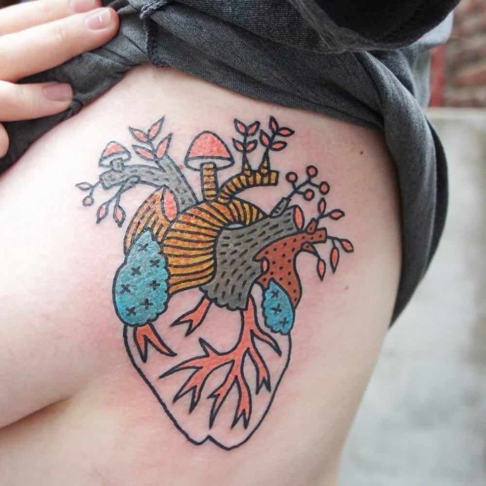 点击大图看下一张：心脏纹身图案    身体各个部位彩绘纹身和写实纹身的心脏纹身图案
