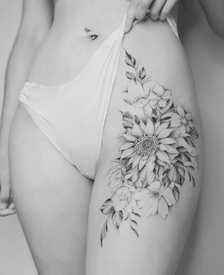 点击大图看下一张：性感花朵纹身--女性大腿侧部性感的花朵纹身