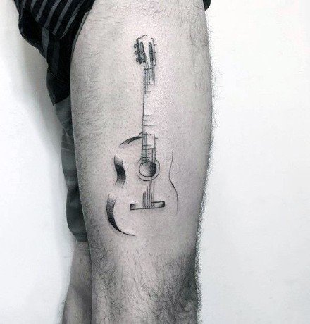 点击大图看下一张：9张乐器吉他相关的纹身图案作品图片