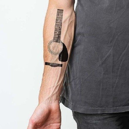 点击大图看下一张：9张乐器吉他相关的纹身图案作品图片