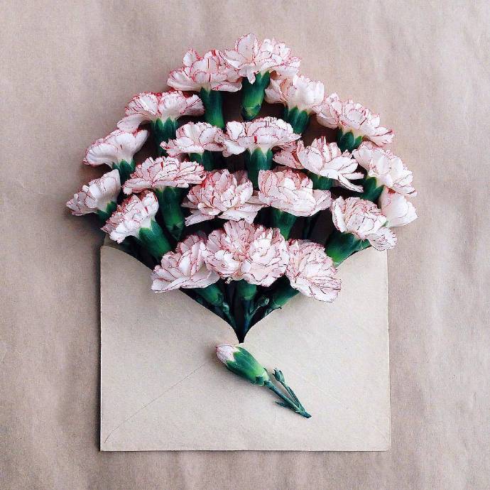 点击大图看下一张：唯美创意的信封花朵壁纸欣赏