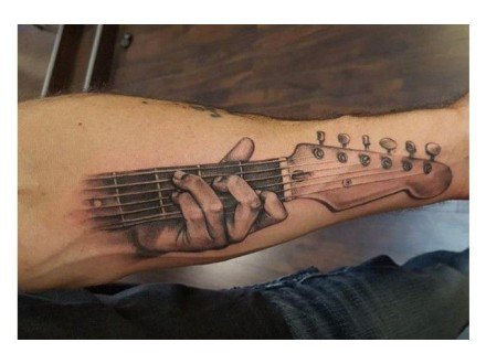 点击大图看下一张：9张适合吉他手的吉他纹身图案