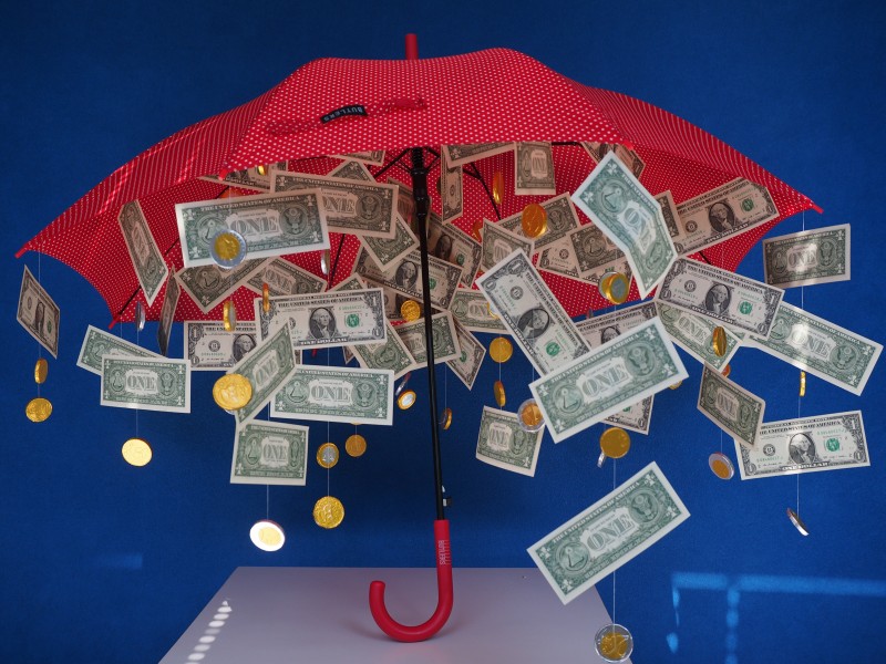 点击大图看下一张：创意美元雨伞图片