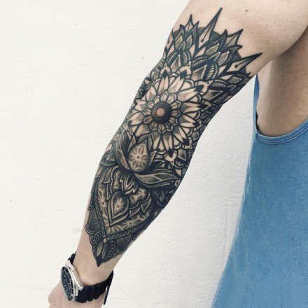 点击大图看下一张：9张手臂上很好看的梵花点刺纹身作品
