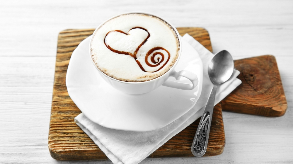 点击大图看下一张：精美的咖啡拉花，让人感觉清香扑鼻，提神醒脑