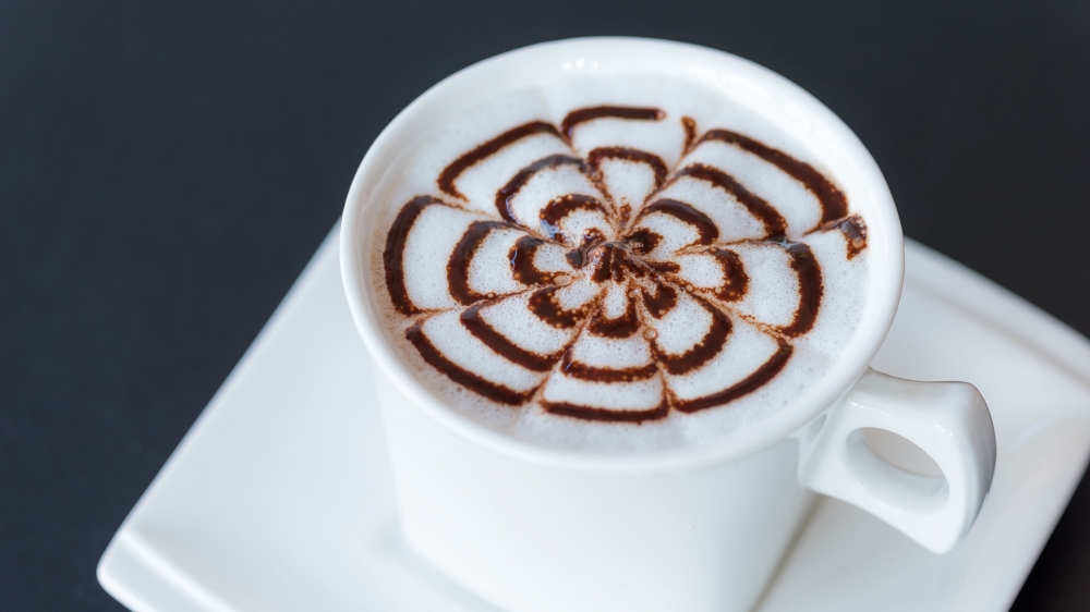 点击大图看下一张：精美的咖啡拉花，让人感觉清香扑鼻，提神醒脑