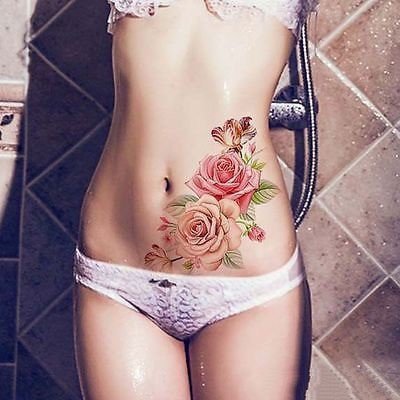 点击大图看下一张：女性小腹私处的性感纹身图案