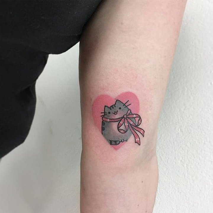 点击大图看下一张：猫的纹身图案   可爱而又灵动机灵的猫纹身图案
