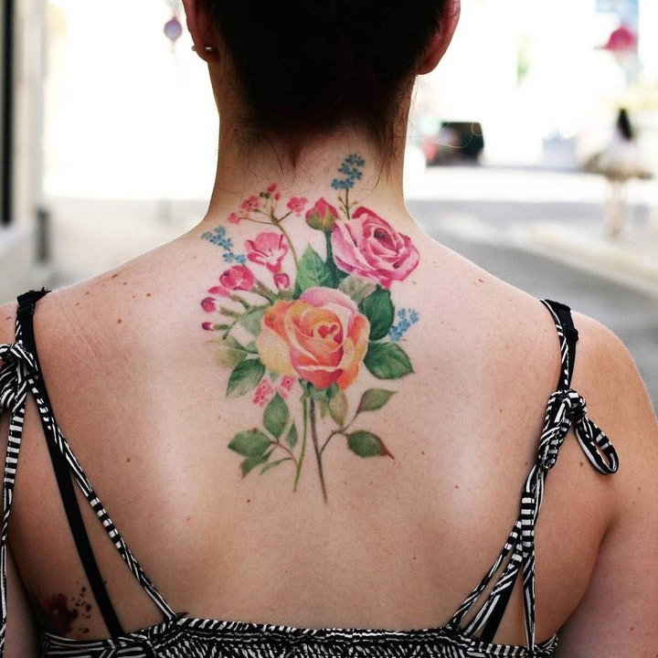 点击大图看下一张：纹身清新小图片   清新而又靓丽色调的花朵纹身图案