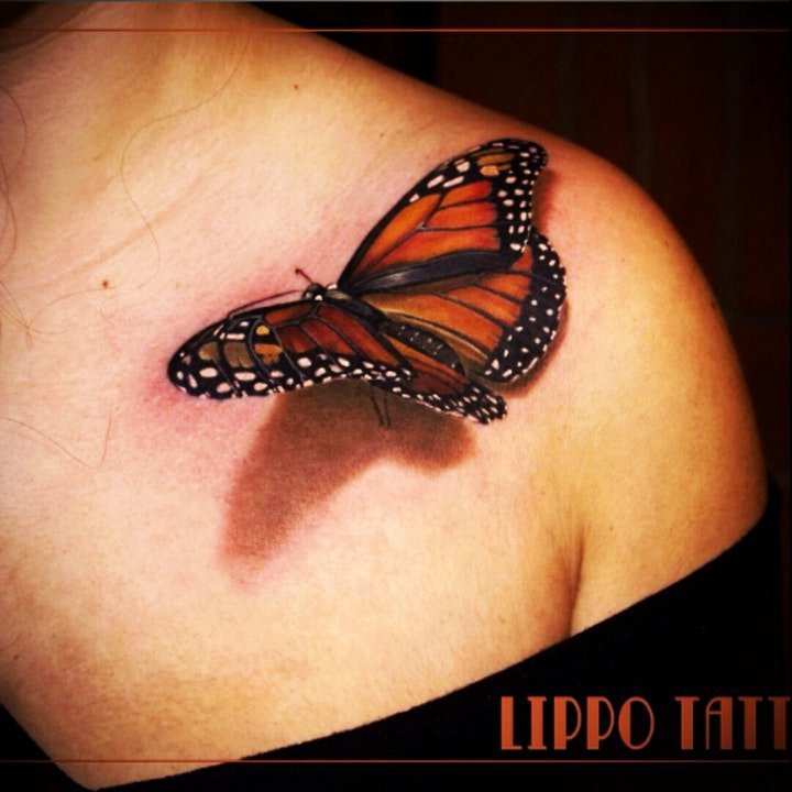 点击大图看下一张：蝴蝶纹身图案 女生身上漂亮的立体蝴蝶纹身图案