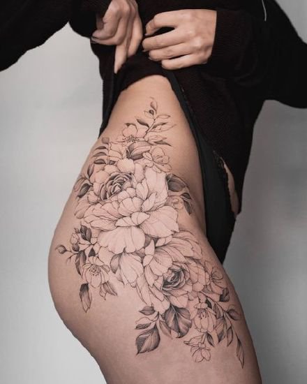 点击大图看下一张：性感大腿纹身  女士大腿处性感的花花纹身图片