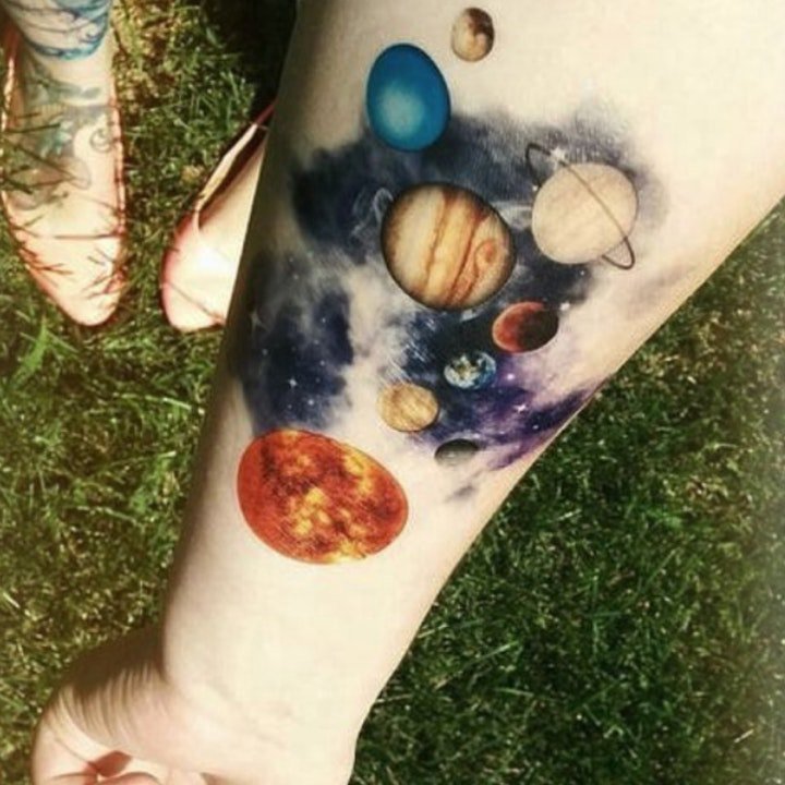 点击大图看下一张：星球 纹身  遥远而又璀璨的星球纹身图案