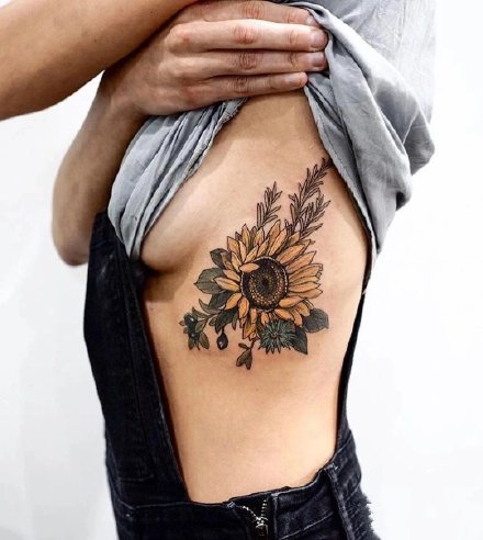 点击大图看下一张：一组9张漂亮的向日葵纹身图片
