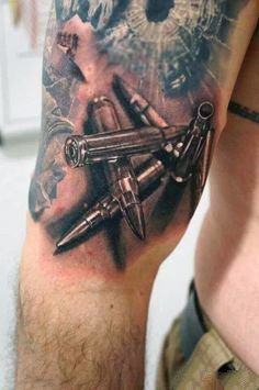 点击大图看下一张：纹身手枪图 帅气的9款枪主题纹身图案