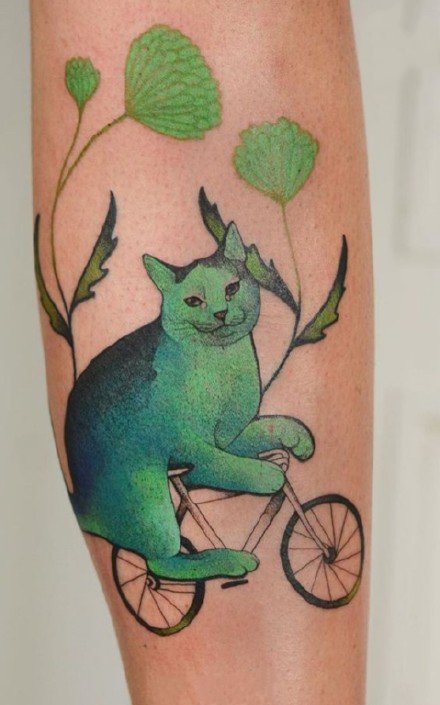 点击大图看下一张：蓝绿色创意的一组猫主题纹身图片